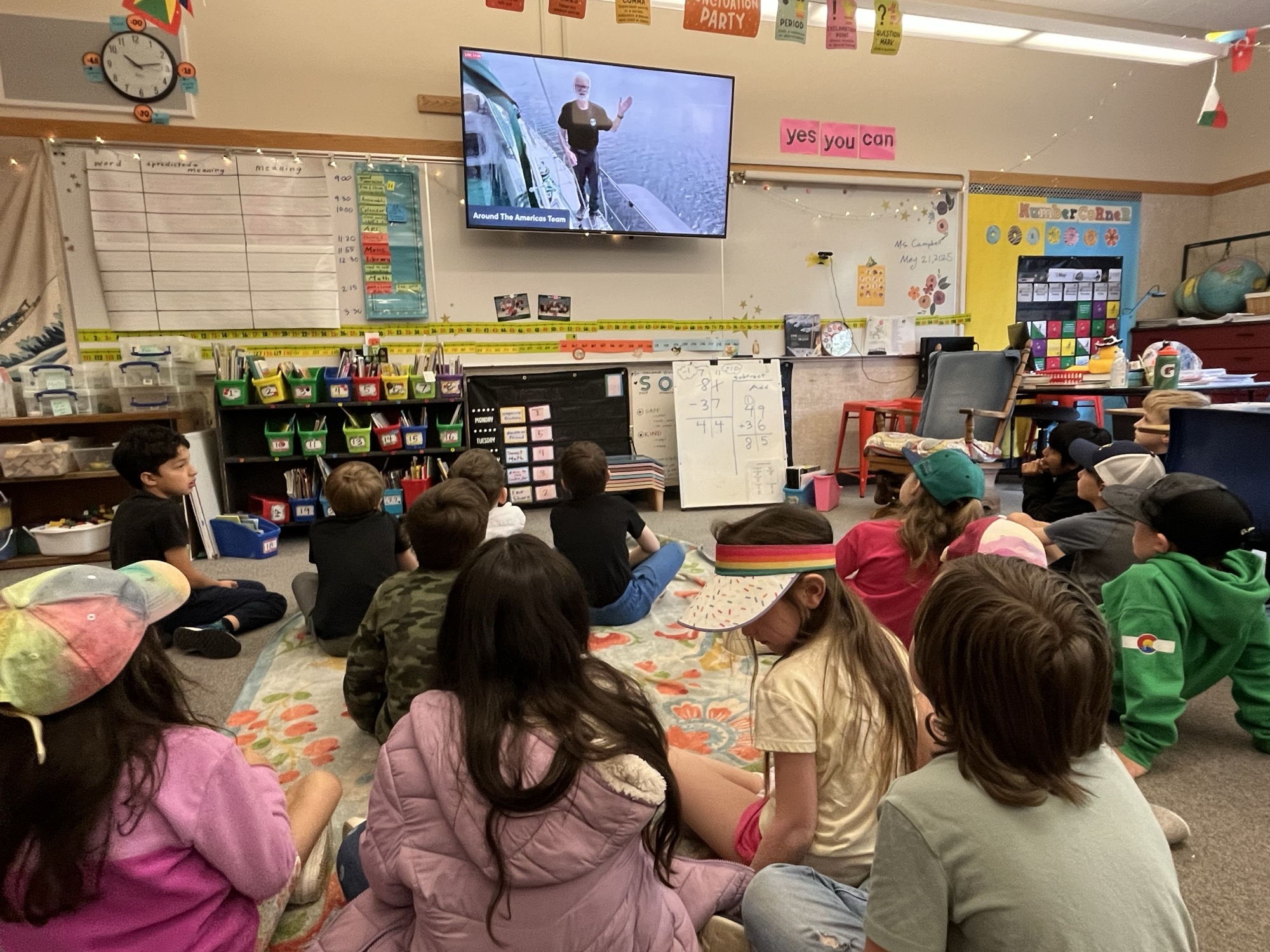 Classroom of students watching a live expedition broadcast