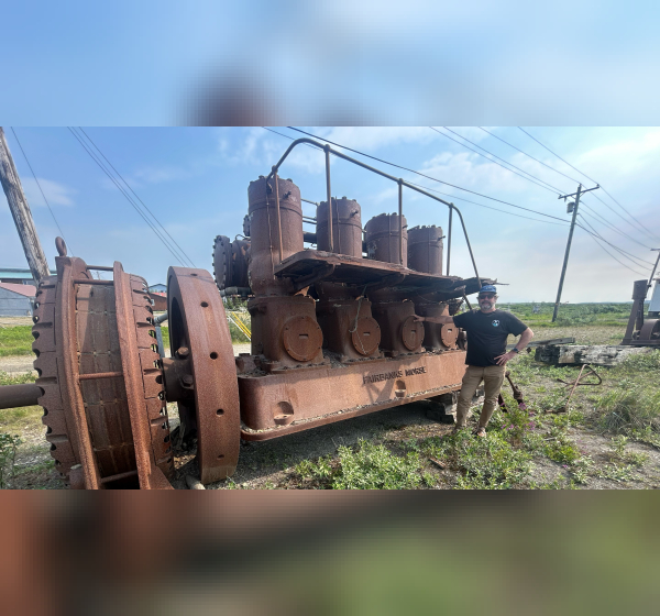 man by old engine