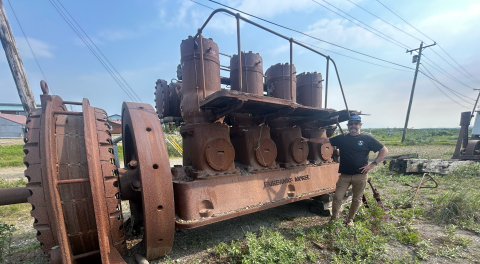 man by old engine