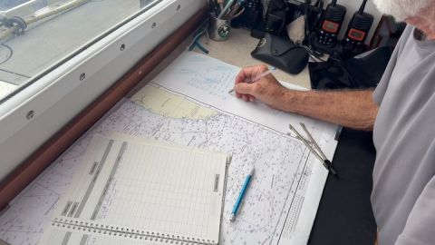 Mark plots our position daily, recording where we are and how many nautical miles we ha…